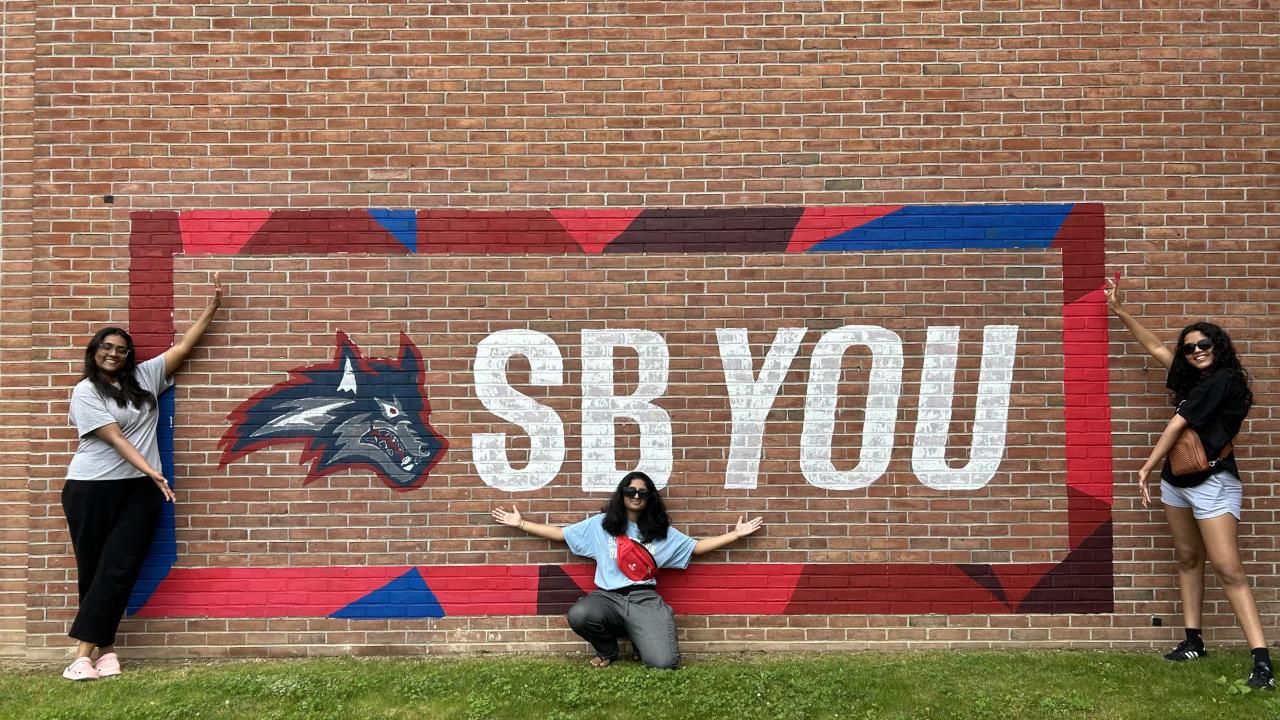 SB You picture of students pointing out the new branding