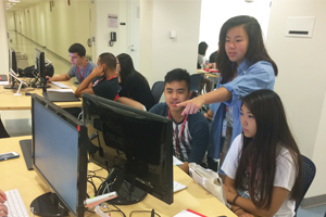 students working together at computer station