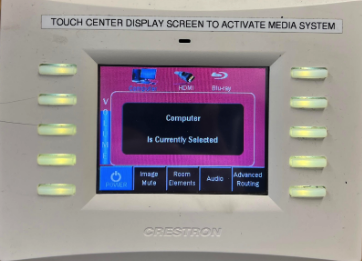 Touch panel with additional physical buttons displaying the home screen with Source options computer and HDMI at the top.