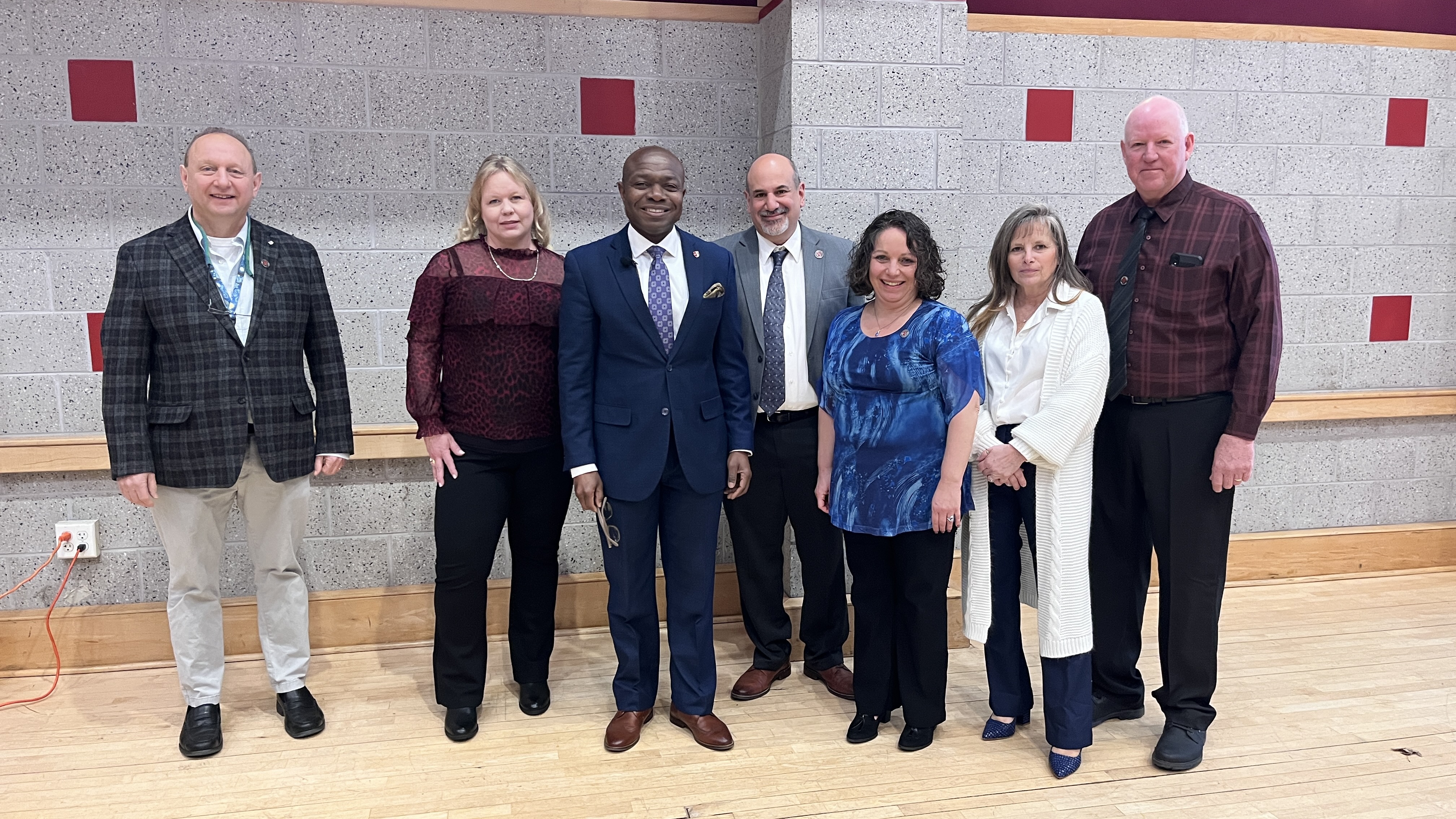 Simeon Anonou joins staff members who celebrated career milestones.