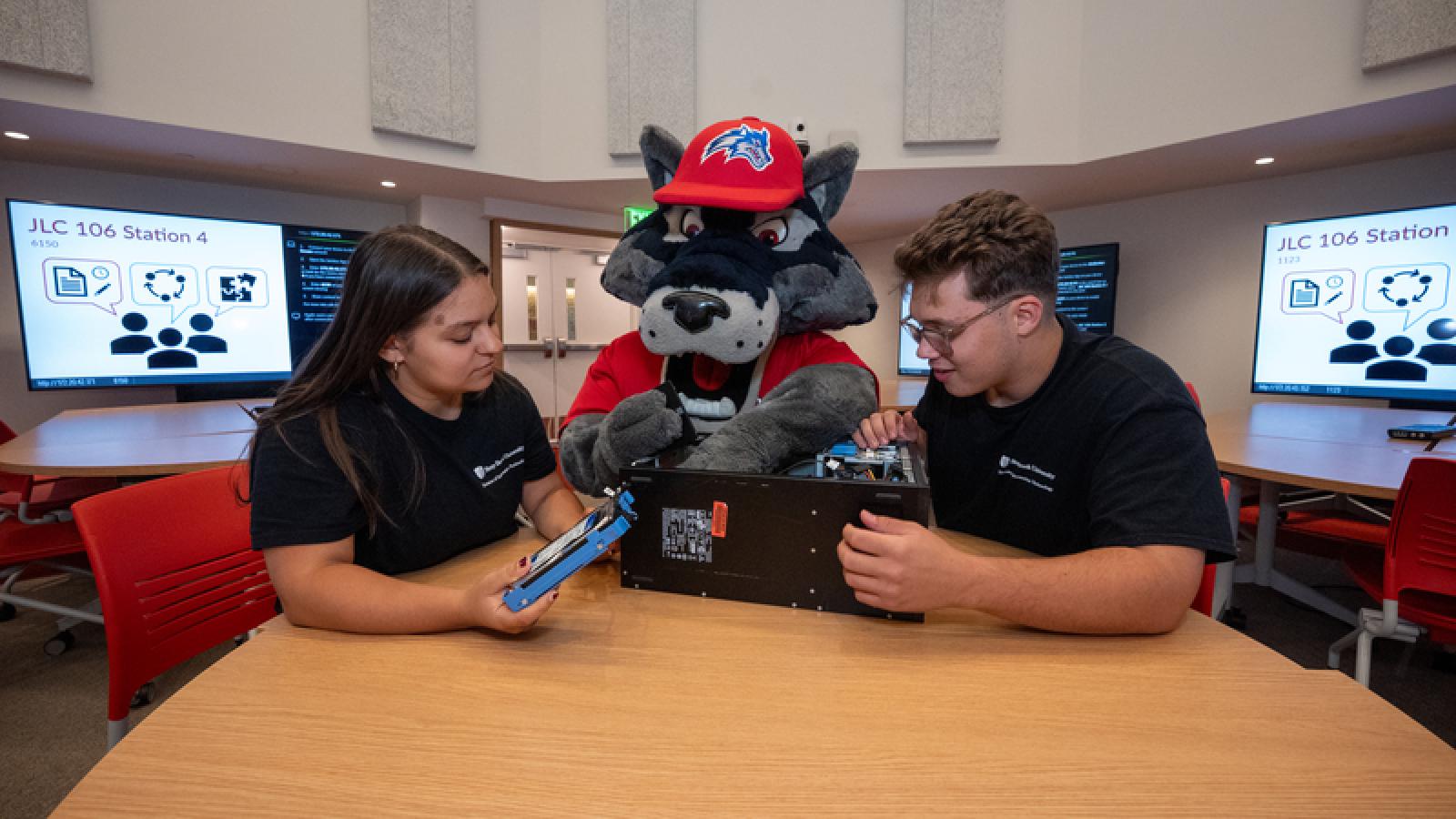 Wolfie with two Students