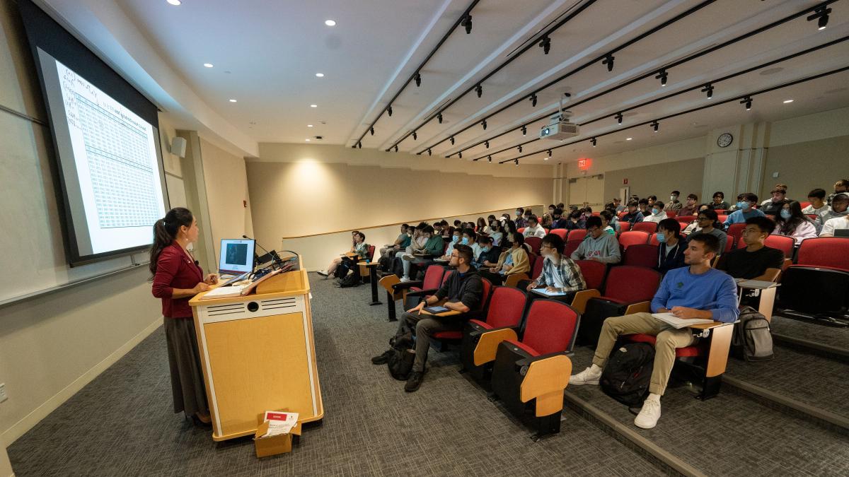 instructor at lectern in classroom