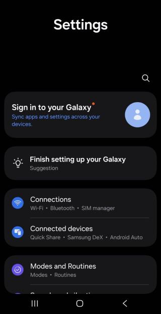 A screenshot of the Samsung Galaxy Settings interface in dark mode. At the top is a search icon. Below it, card-style menu options include "Sign in to your Galaxy," "Finish setting up your Galaxy," "Connections (Wi-Fi, Bluetooth, SIM manager)," "Connected devices (Quick Share, Samsung DeX, Android Auto)," and "Modes and Routines." Standard Android navigation buttons are visible at the bottom.